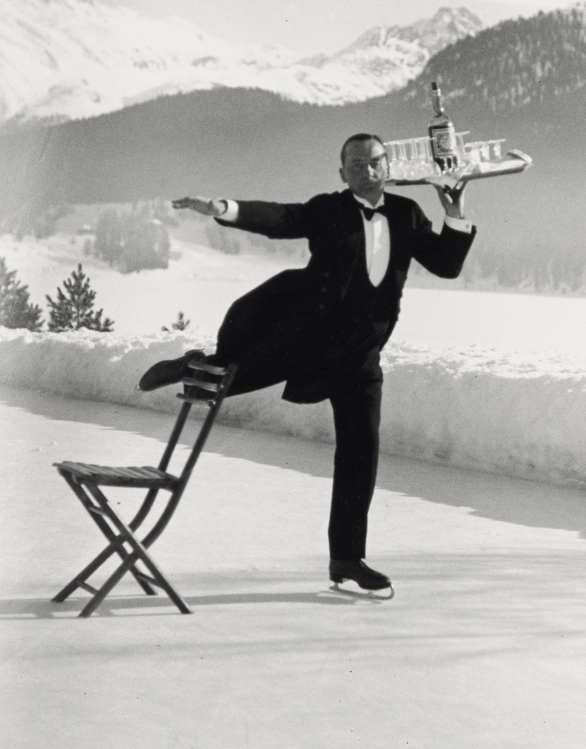 ALFRED EISENSTAEDT (1898-1995) Ice Skating Waiter, St. Moritz.